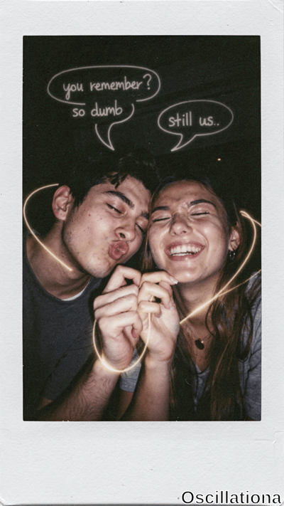 Vintage Instax Polaroid with white borders on black background: close-up of young couple in playful romantic embrace. Curly-haired man puckers lips; wavy-haired woman smiles widely with hoop earrings. Golden light trails glow on